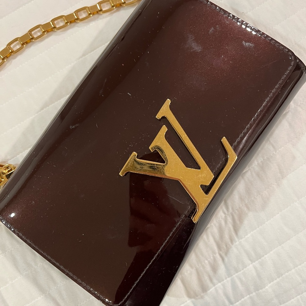 Lv clutch and hand bag almost new